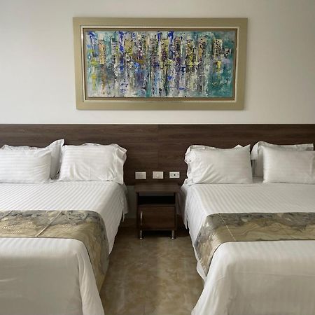 Hotel Royal Elim International Cali Esterno foto A room at the hotel