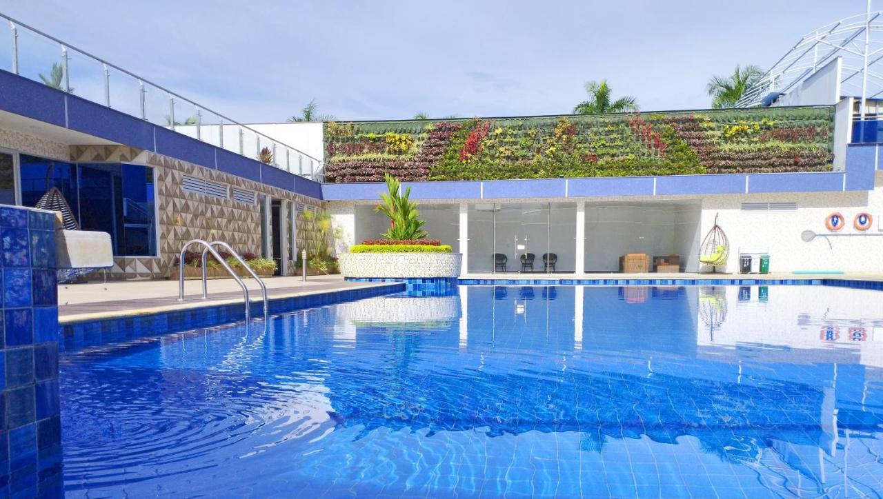 Hotel Royal Elim International Cali Esterno foto The swimming pool at the hotel