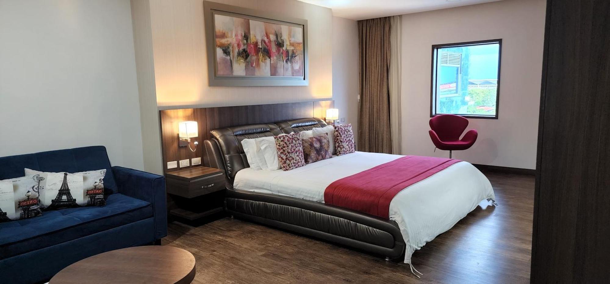 Hotel Royal Elim International Cali Esterno foto A bedroom at the hotel