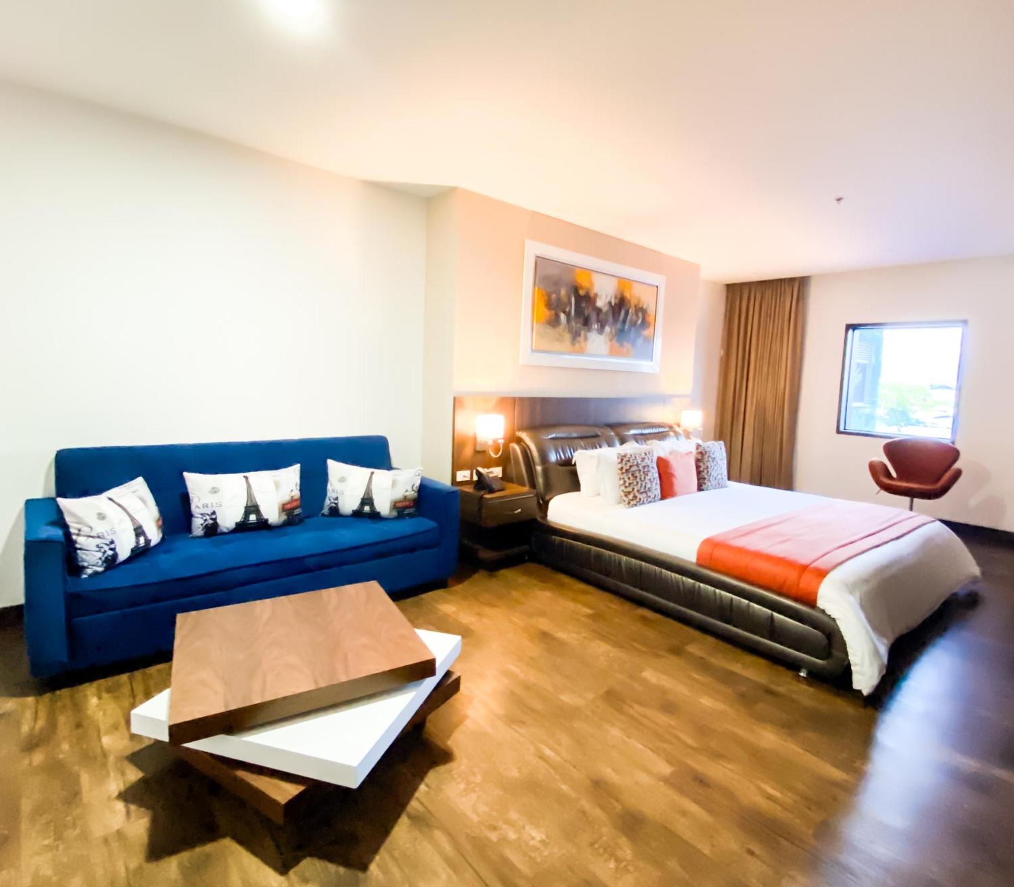 Hotel Royal Elim International Cali Esterno foto A room at the hotel