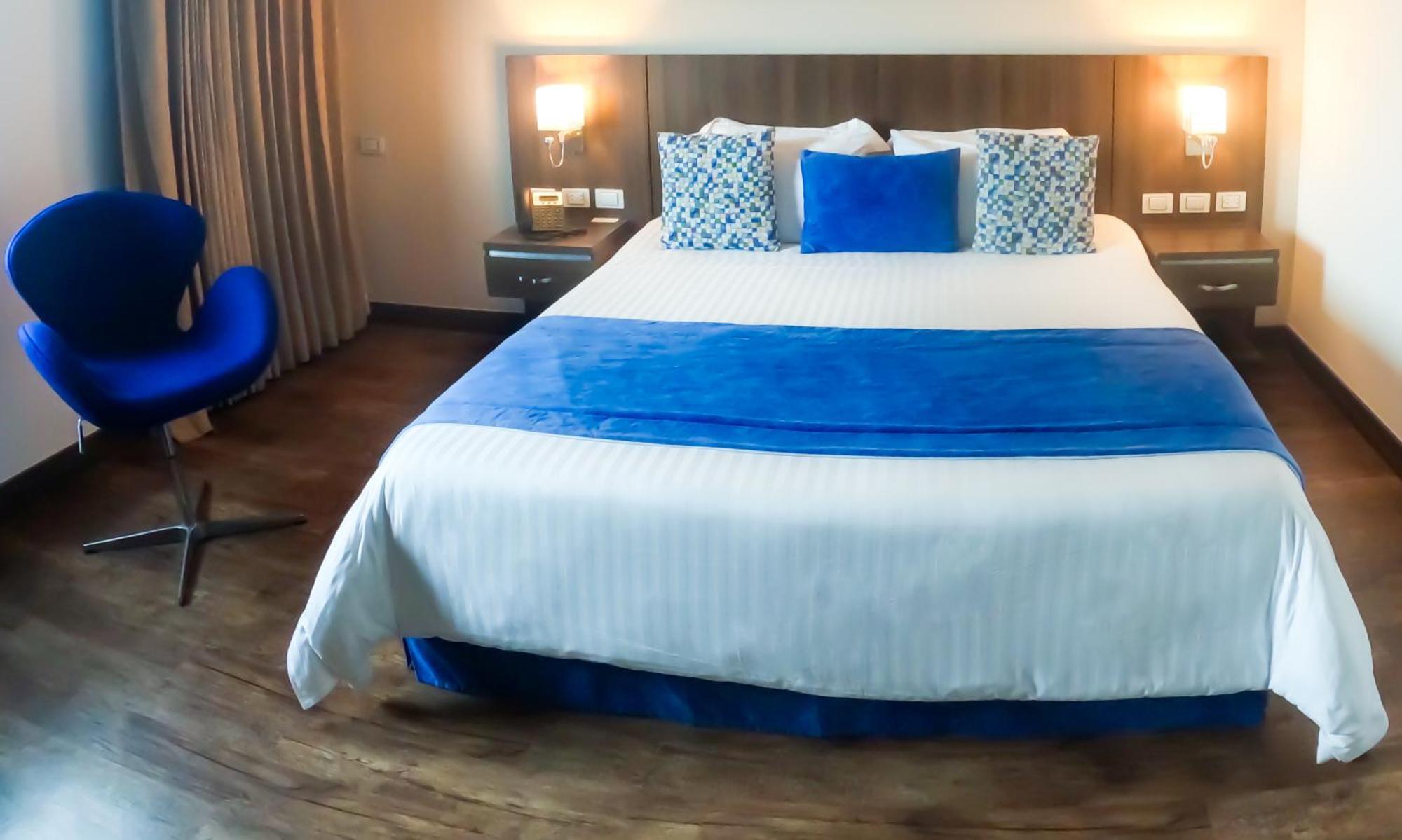 Hotel Royal Elim International Cali Esterno foto A bedroom at the hotel