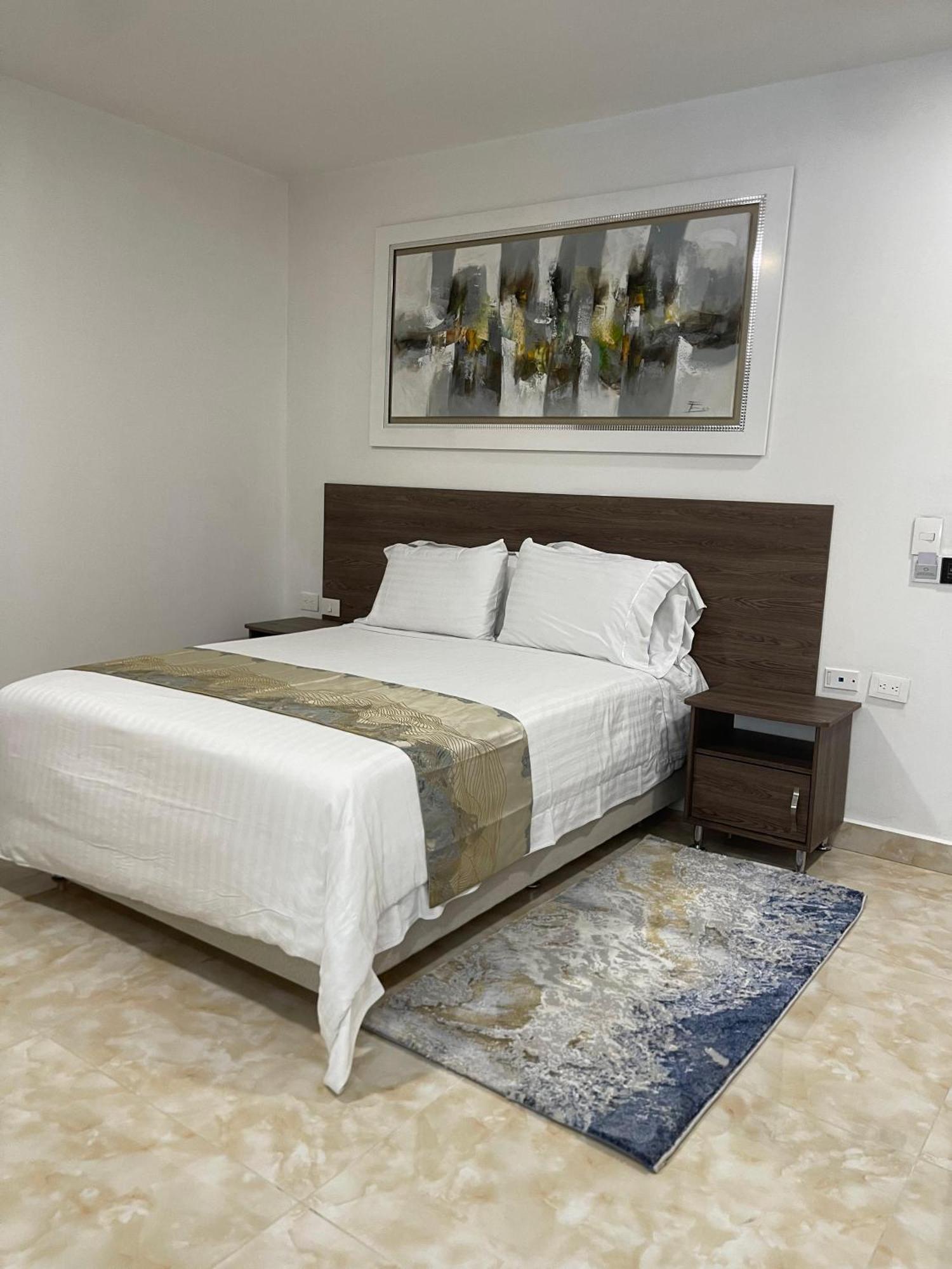 Hotel Royal Elim International Cali Esterno foto A bedroom at the hotel